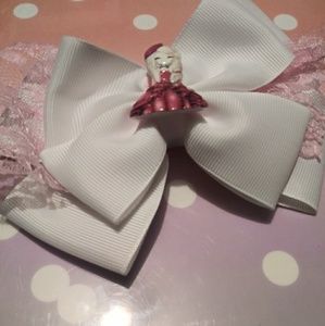 Beautiful Lace Adorned Bow with attached Doll